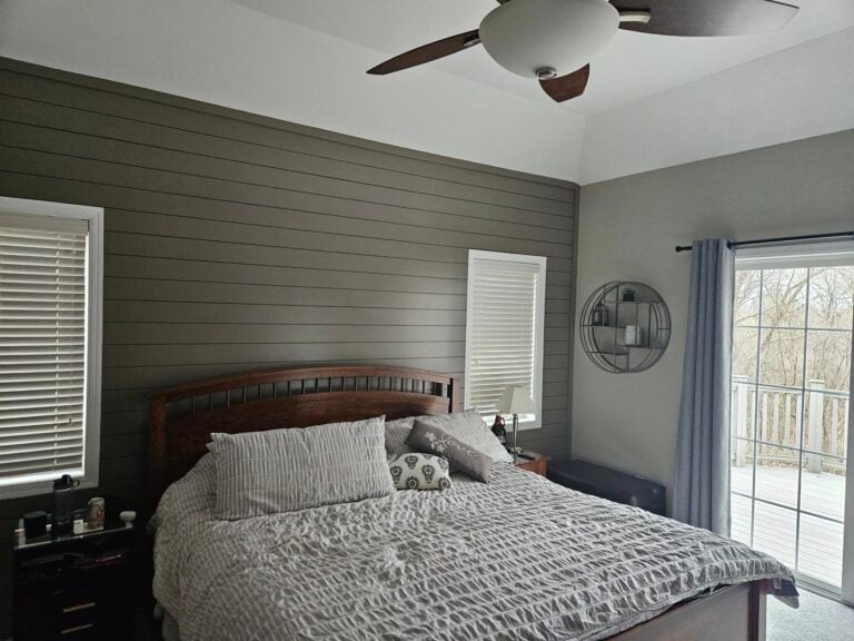 Bedroom with gray painted walls and white trim