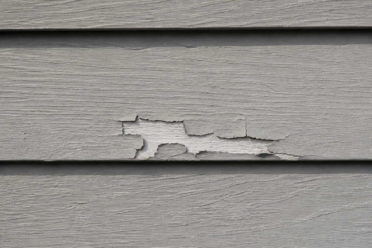 Illustration of localized peeling coating on engineered wood lap siding