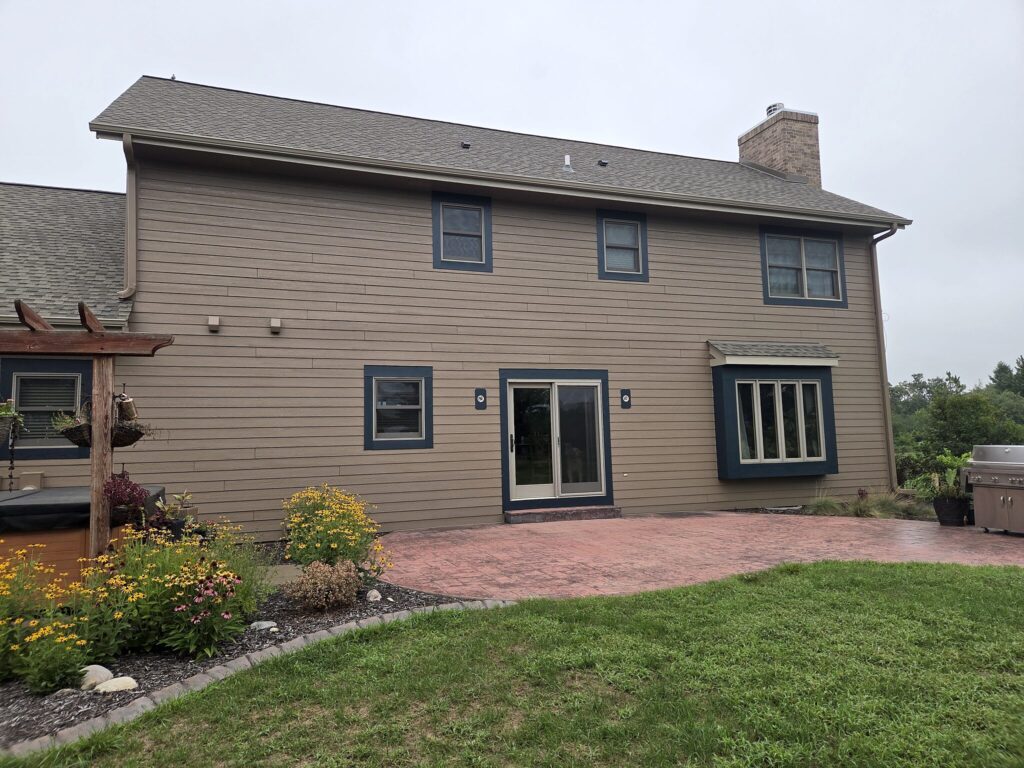 Rear of a tan LP SmartSide home in Eagle after exterior painting