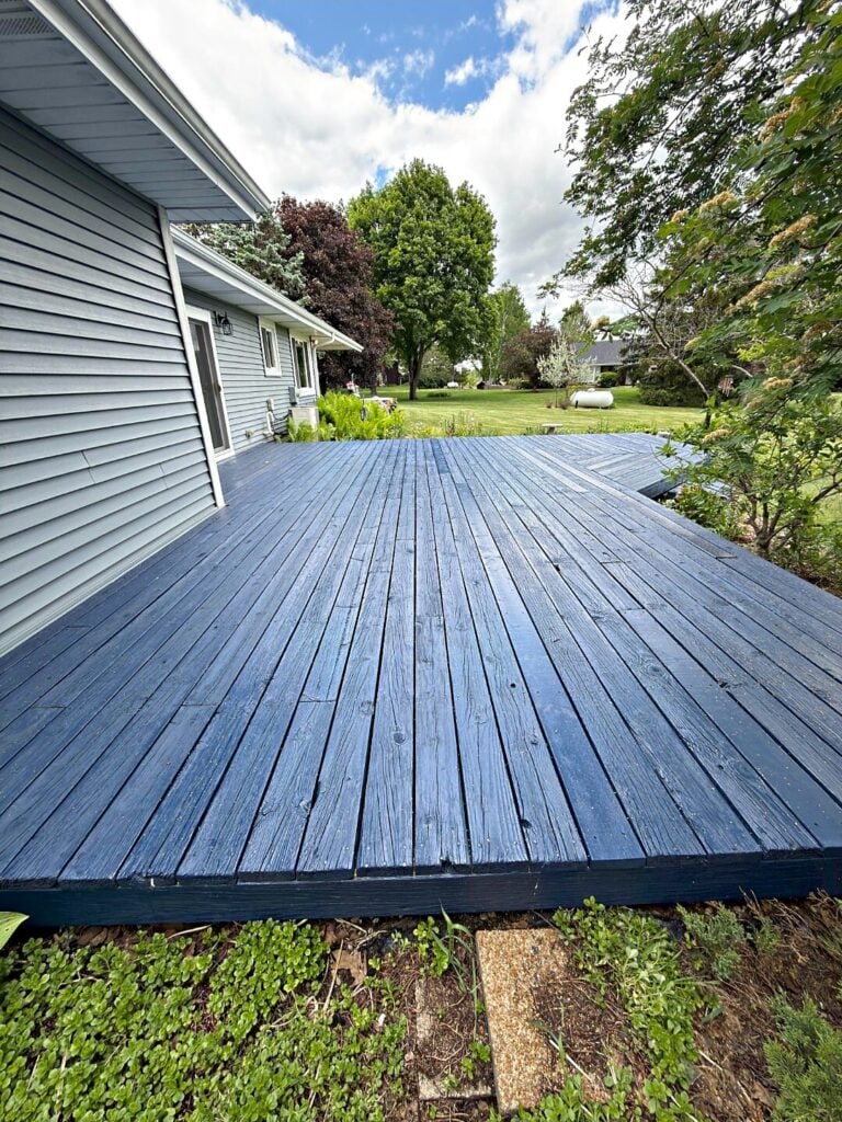 Blue-gray stained deck boards in Oconomowoc