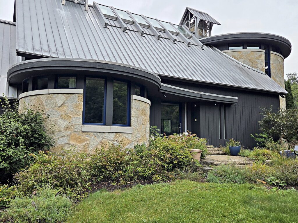Dark house stone wall windows in Mukwonago