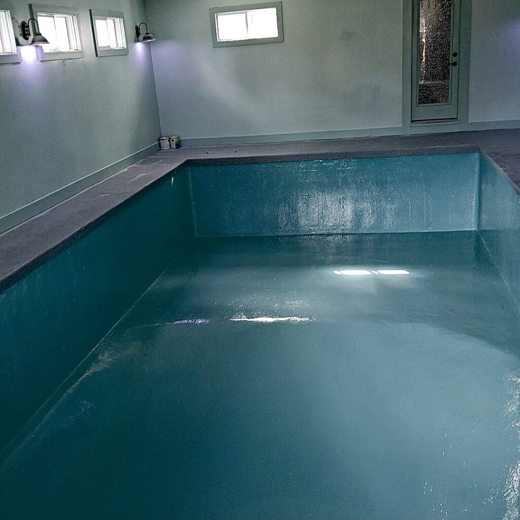 Empty indoor pool blue surface in Lake Mills
