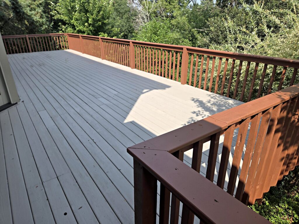 Gray deck boards brown railing in Waukesha