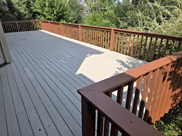 Gray deck boards brown railing in Waukesha