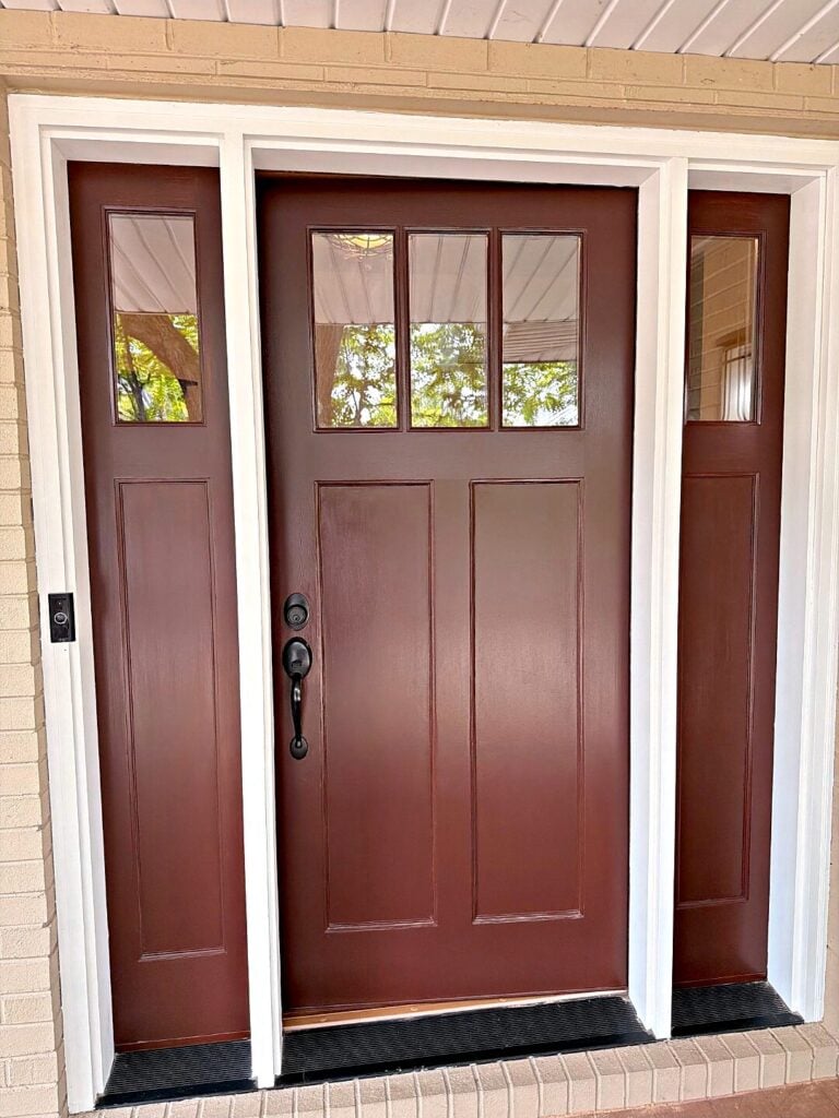 Red front door white trim in East Troy