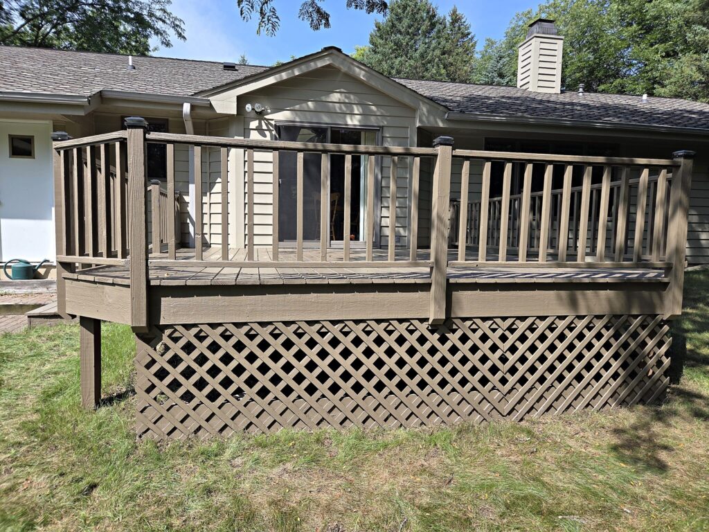 Weathered wood deck railing in Waukesha